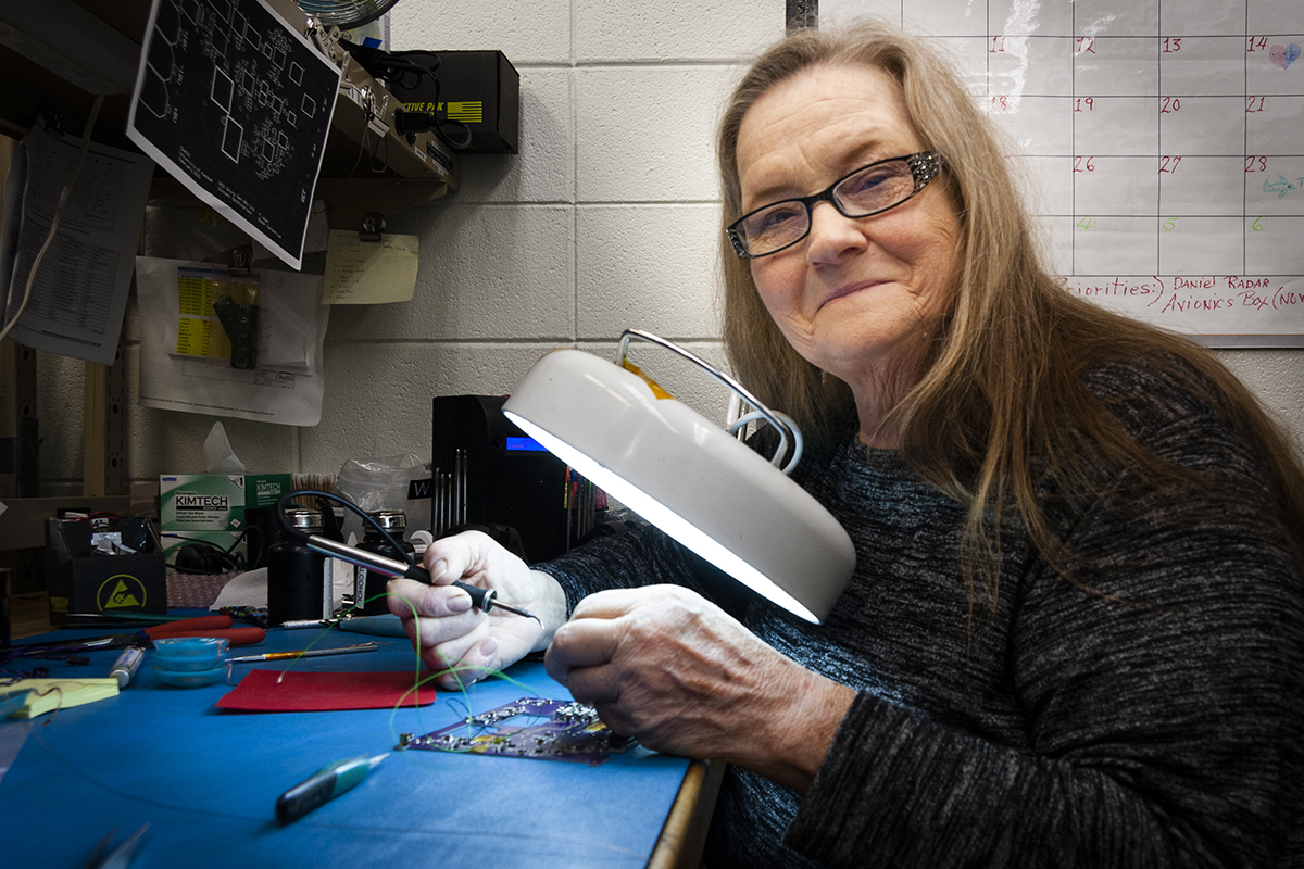 Paulette Place- CReSIS technician soldering a circuit board for a radar